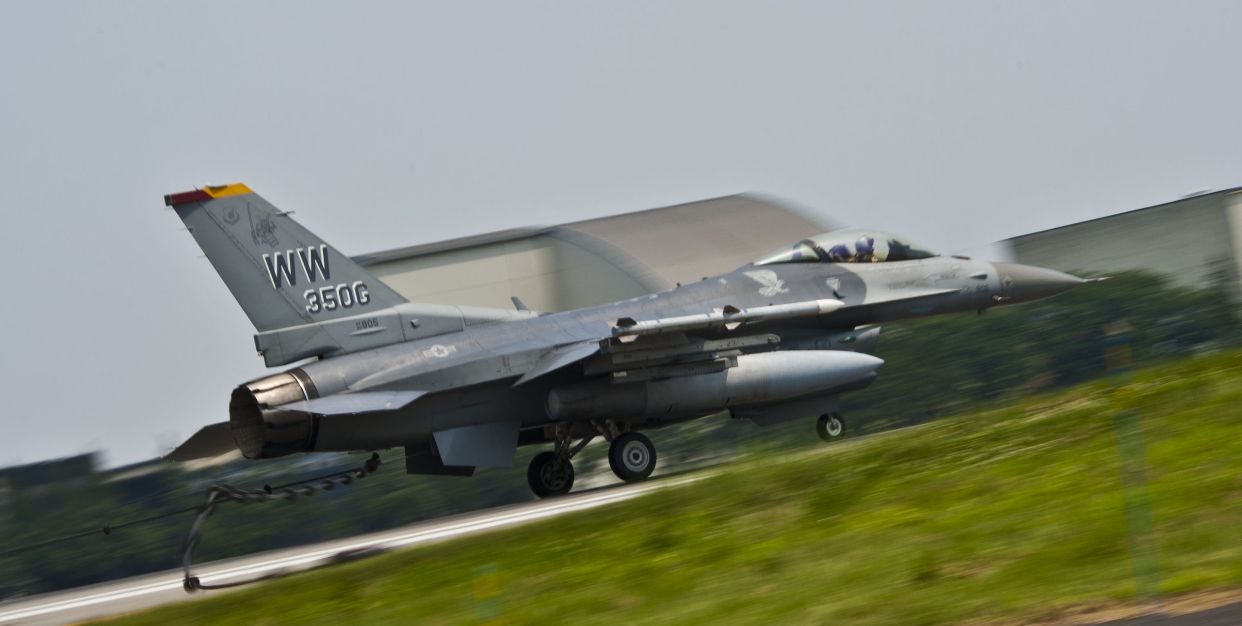 YOKOTA AIR BASE, Japan An F-16 Falcon performs a high-speed taxi and hooks onto the arresting cable at Yokota Air Base, Japan, July 10, 2013. The arresting gear is used to rapidly decelerate an aircraft during in-flight emergency landing, saving the life of pilot and the aircraft. Two F-16s from Misawa Air Base, Japan, assisted with testing the system. (U.S. Air Force photo by Airman 1st Class Soo C. Kim)